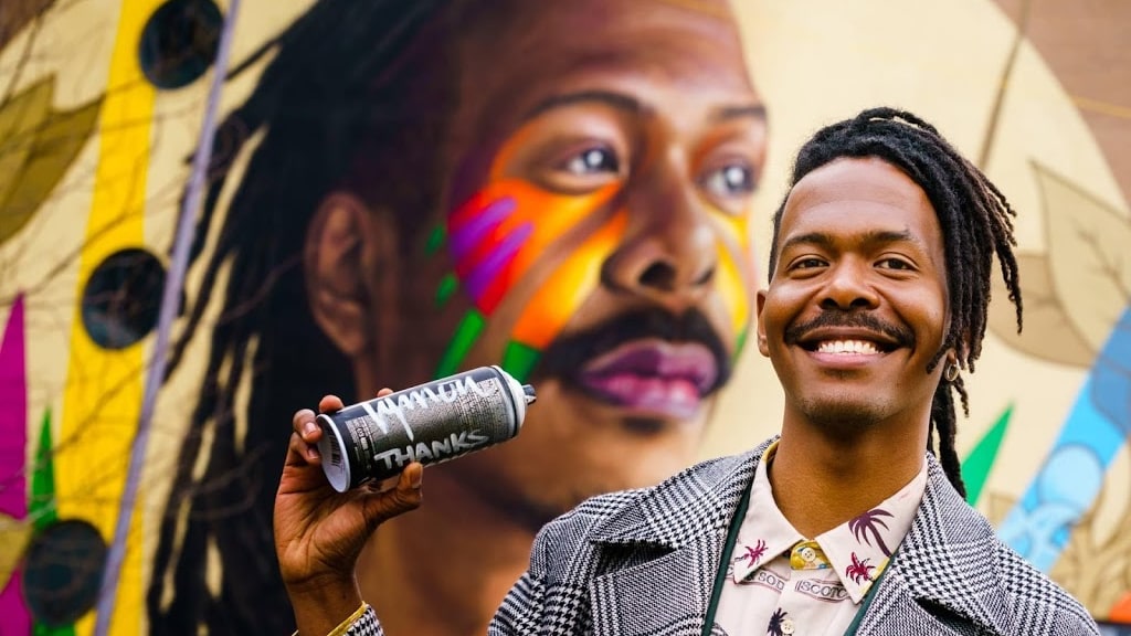 Jeangu Macrooy overweldigd door muurschildering van hem