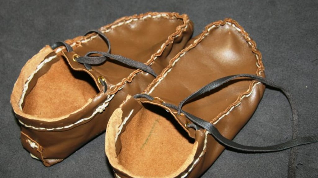 De eigengemaakte schoenen.