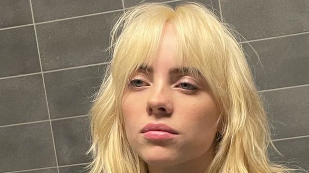 Wassenbeeld Billie Eilish door het slijk gehaald