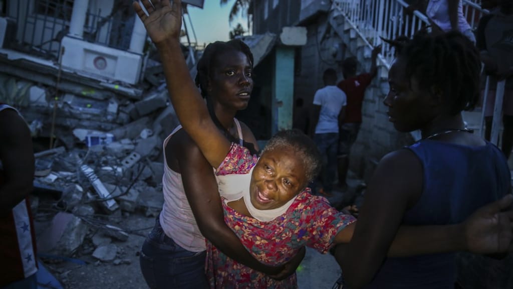 Dodental aardbeving Haïti opgelopen tot 1297, Rode Kruis opent giro 5125