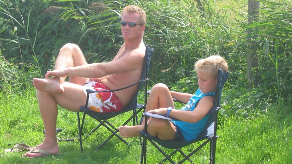 Robbie als kind samen met zijn vader.