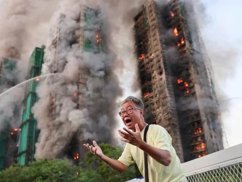 Dit is de man achter de iconische foto van de flatbranden in Hongkong: 'Ik kom je zoeken'