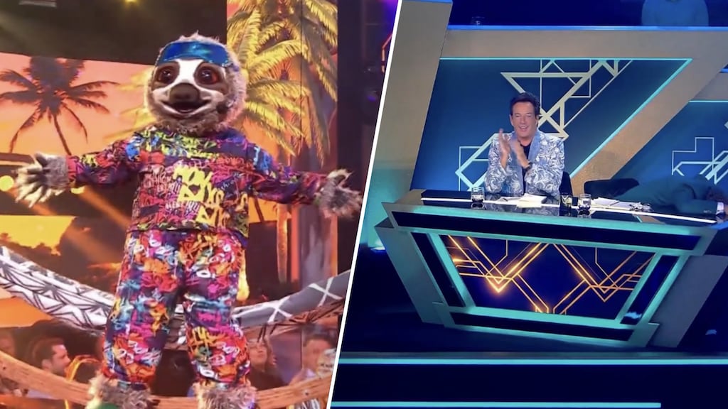 Carlo Boszhard duikt onder desk na onthulling in The Masked Singer